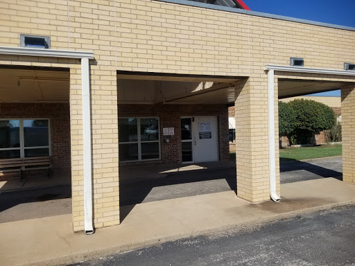 An exterior view of a school building showcasing its entrance.