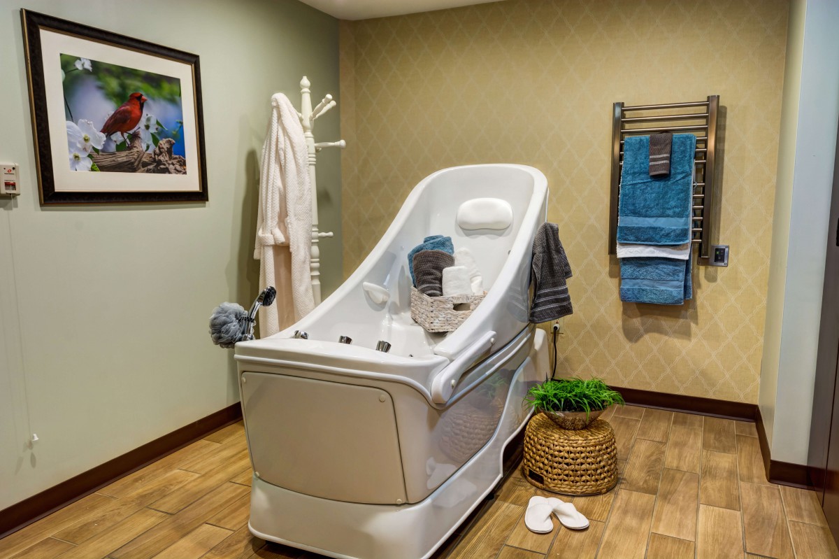 A luxurious spa room featuring a massage tub and relaxing ambiance.