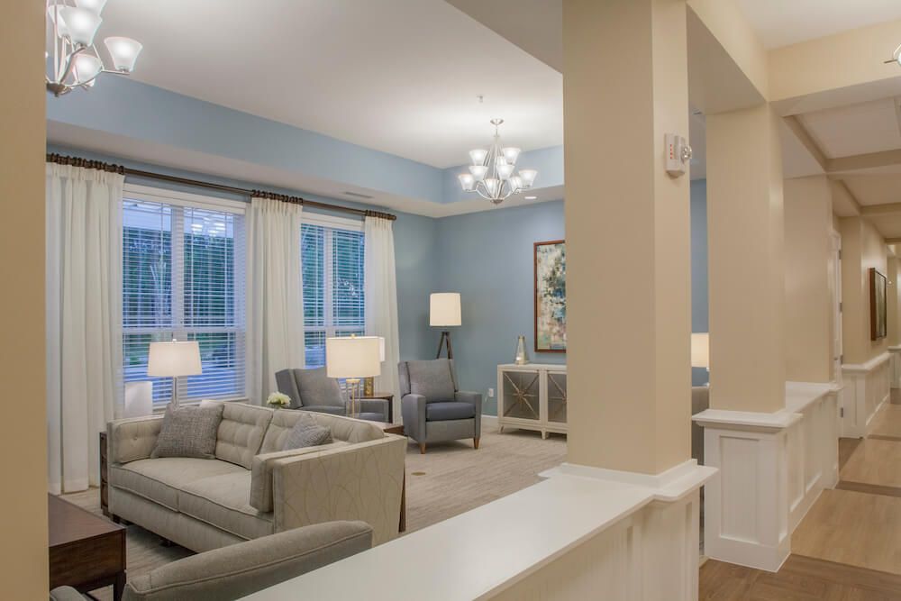 A modern living room with elegant decor and neutral colors.