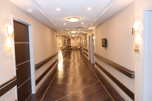 A well-lit and modern hallway, featuring stylish woodwork and a polished floor.