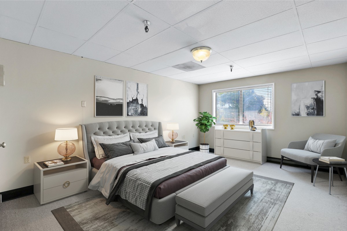 A modern, well-decorated bedroom with elegant furnishings and natural light.
