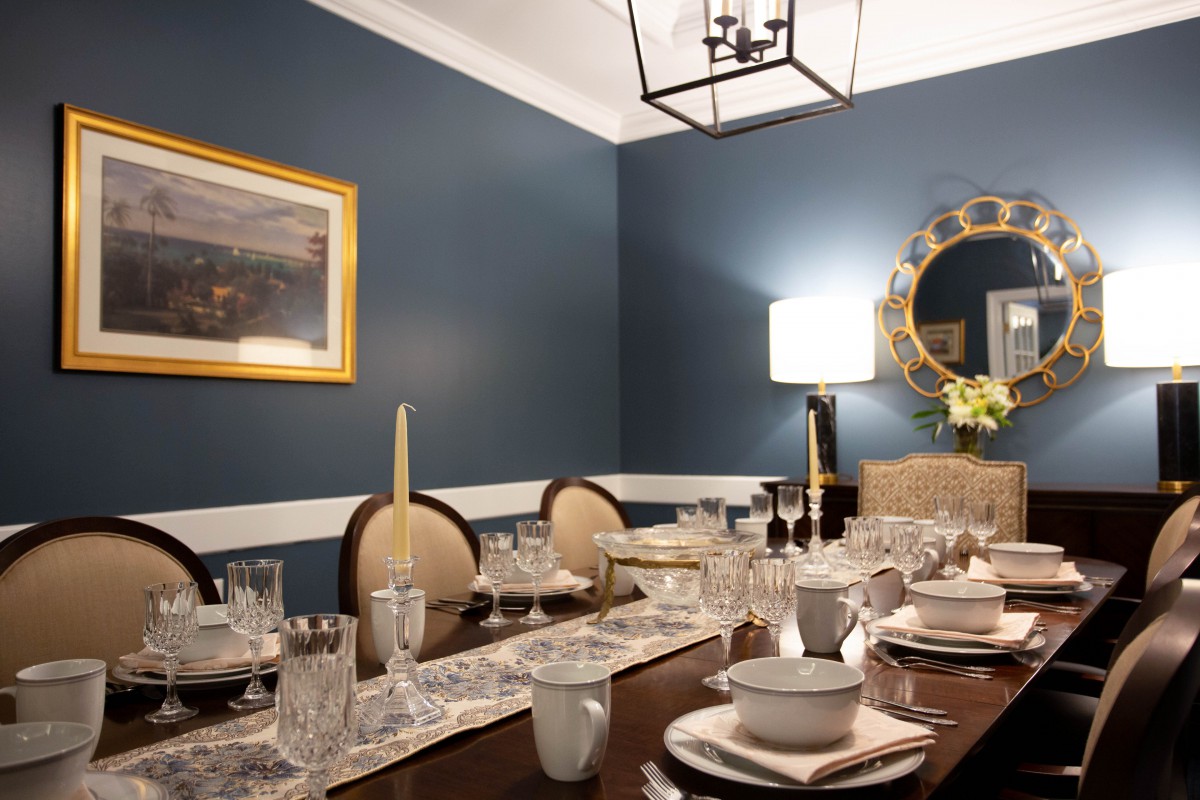 A stylish dining room with an elegantly set table and sophisticated decor.
