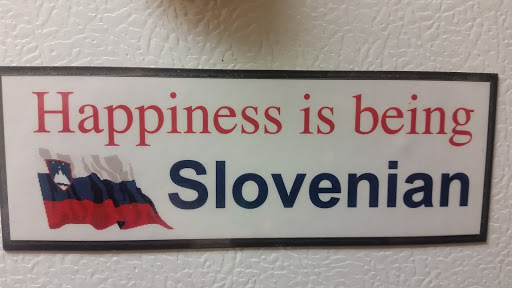 A sign celebrating the happiness associated with being Slovenian.