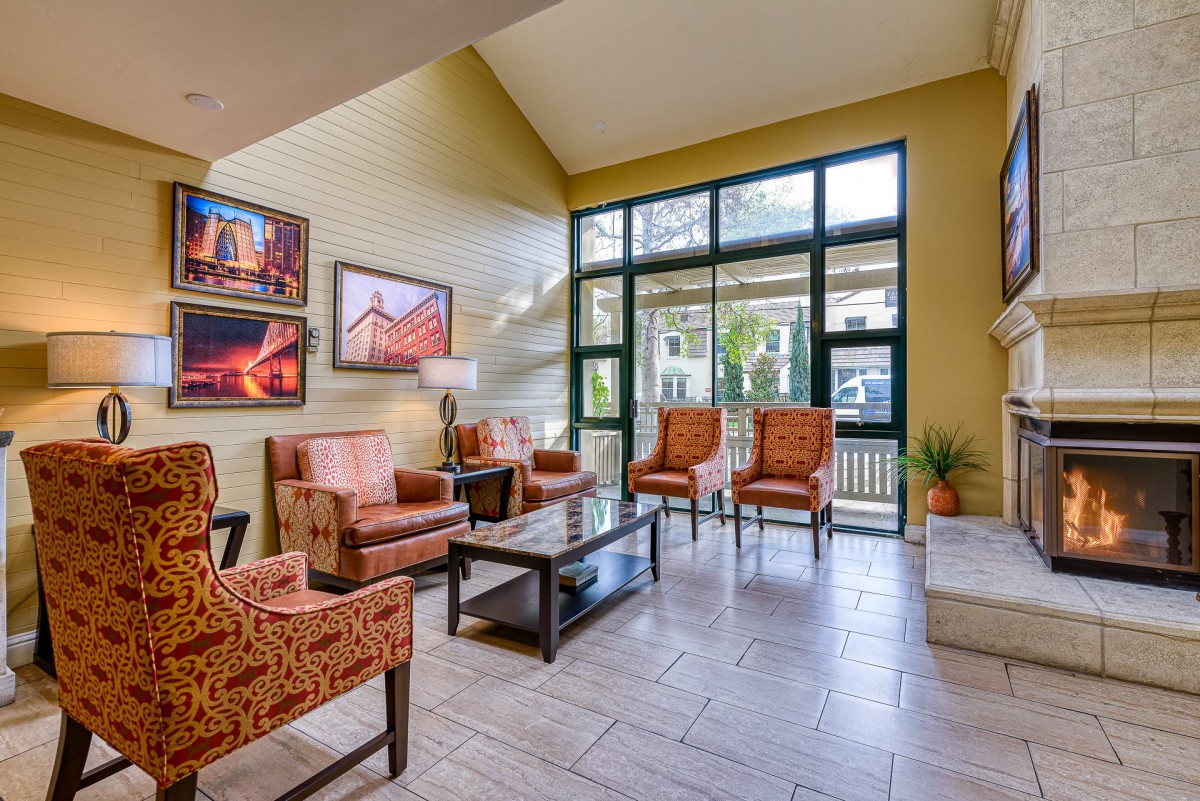 A cozy lobby area with elegant seating and artwork.