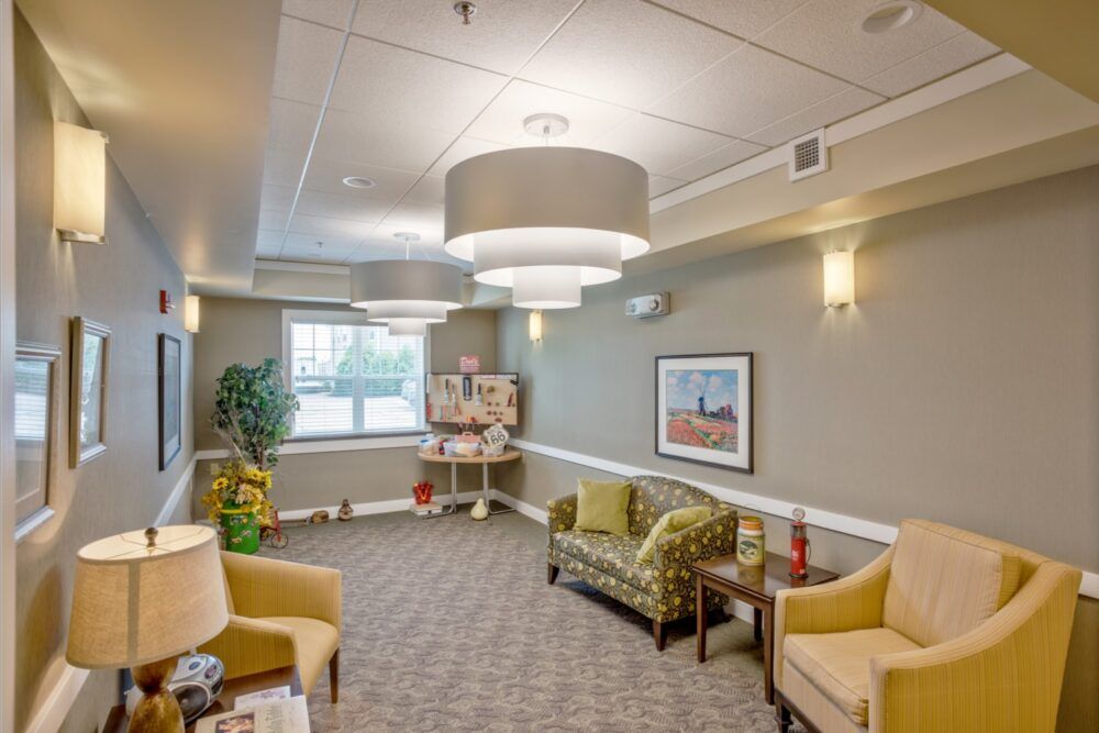 A cozy waiting room with comfortable seating and modern lighting.