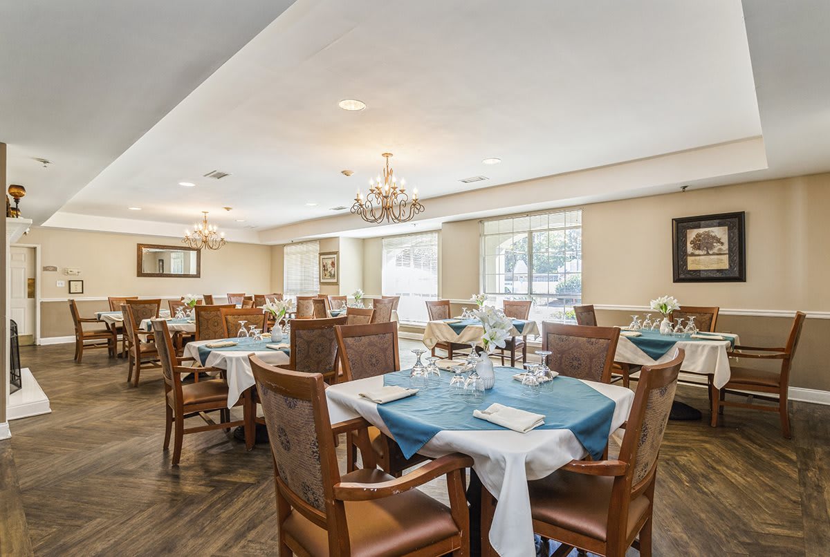 An elegant dining room with neatly arranged tables and sophisticated decor.