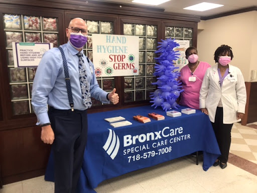 Staff members at BronxCare promoting germ prevention and public health.