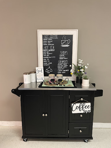 A stylish coffee station complete with a chalkboard menu and decorative plants.