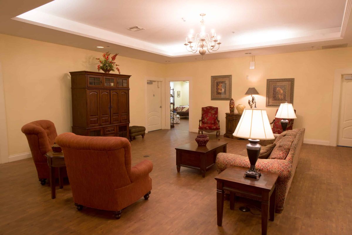 A cozy living room with traditional furnishings and warm lighting.