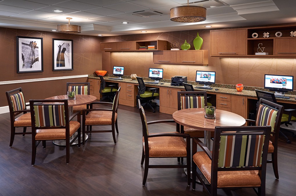 A modern office space with computers and seating areas.