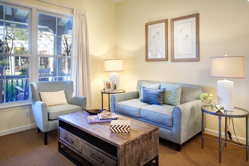 A cozy living room with modern furnishings and soft lighting.