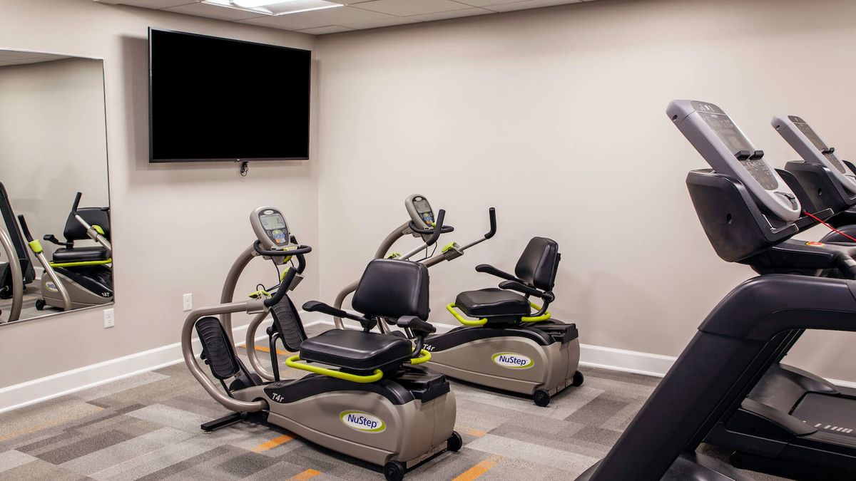 A modern gym equipped with stationary bikes.