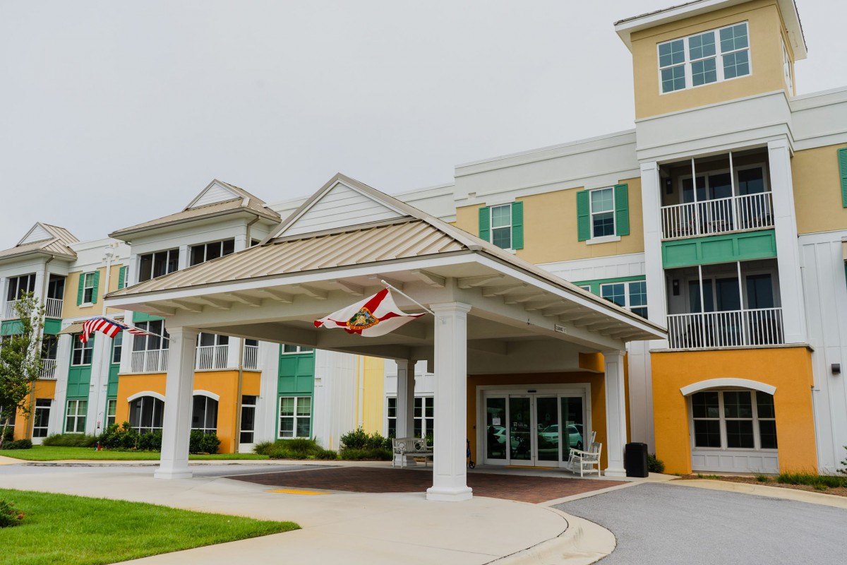 A modern building with a prominent entrance canopy.