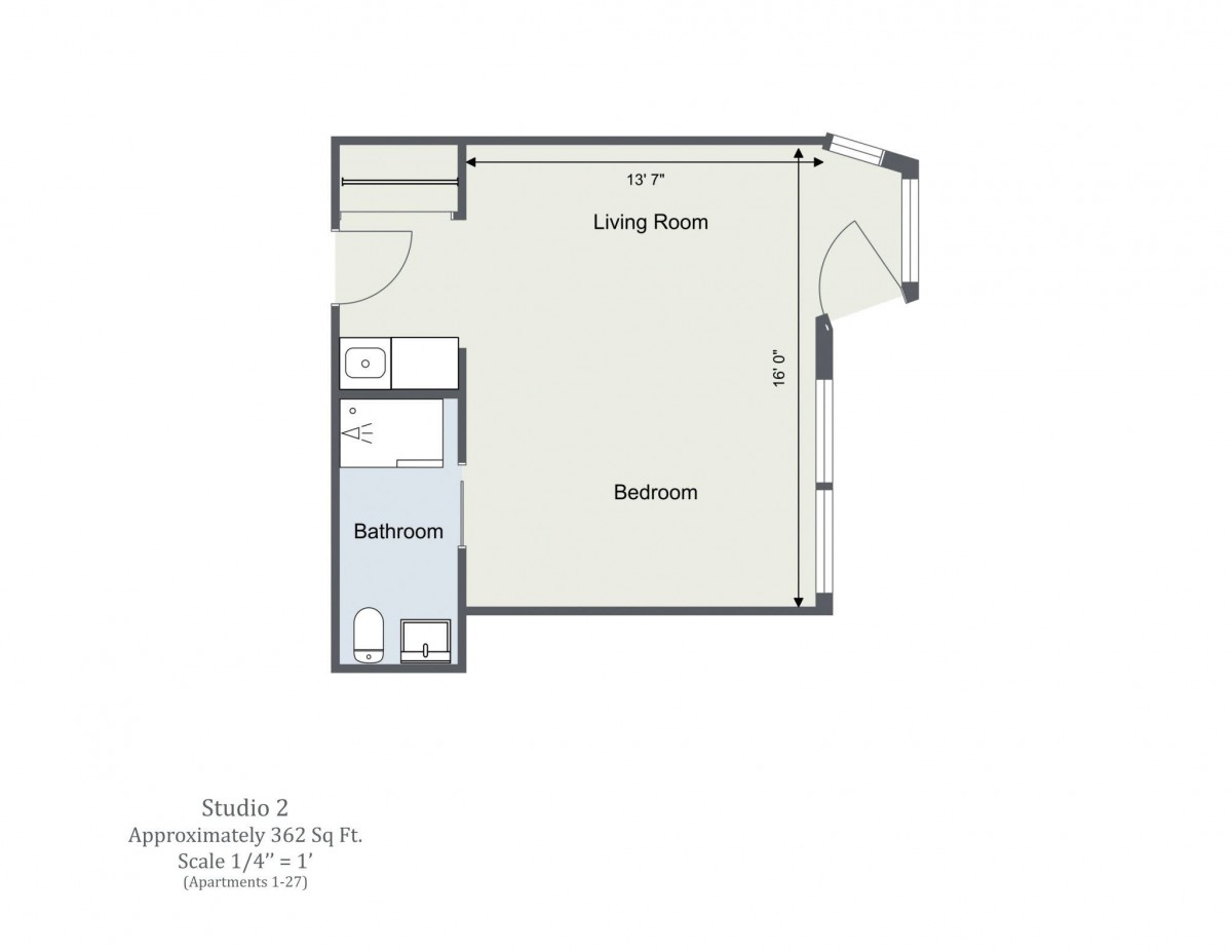Studio apartment floor plan with living room, bedroom area, and bathroom.
