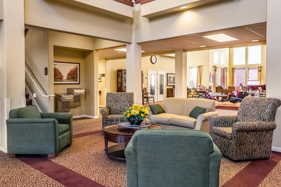 A cozy and modern living room with comfortable seating arrangements and stylish decor.