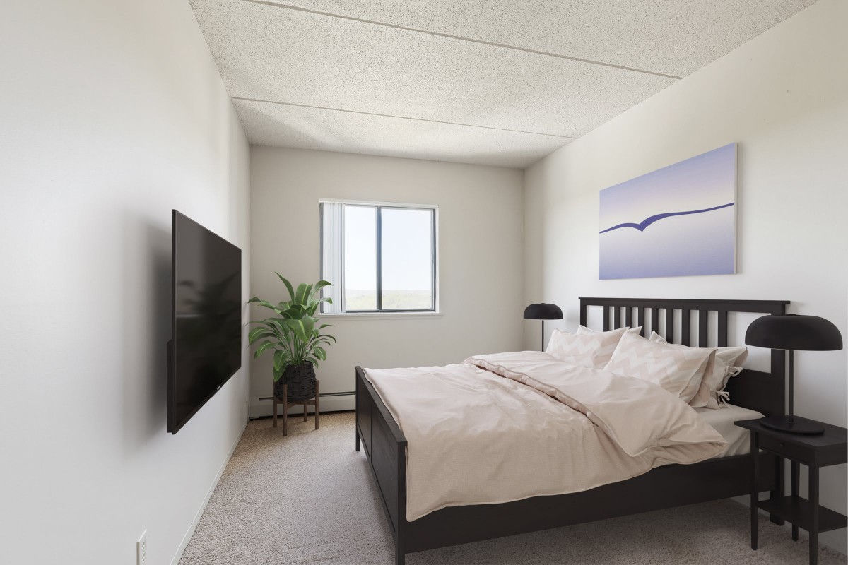 A modern and minimalist bedroom with a cozy bed, wall-mounted TV, and simple decor.