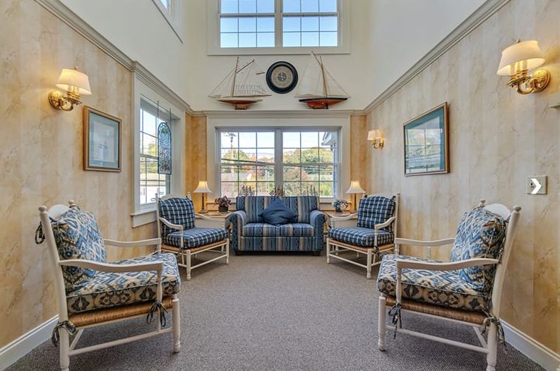 A cozy living room with ample seating and natural light.