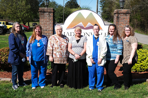 A group of staff members posing outside the Madisonville facility.