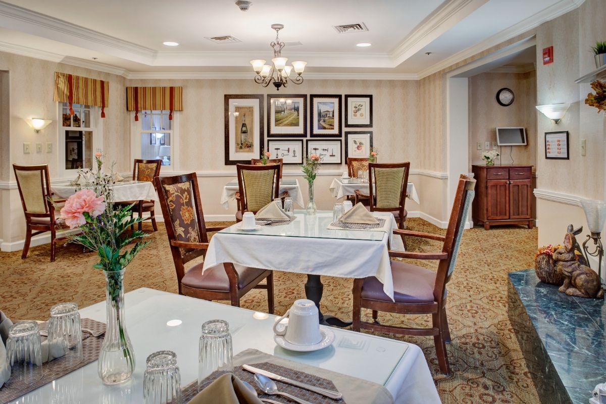 An elegant dining room with neatly set tables and classic decor.