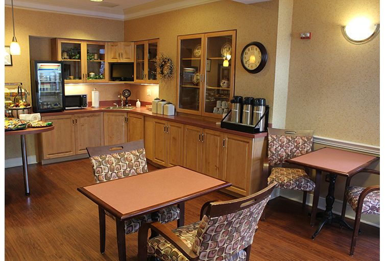 A cozy kitchen and dining area with wooden furniture.