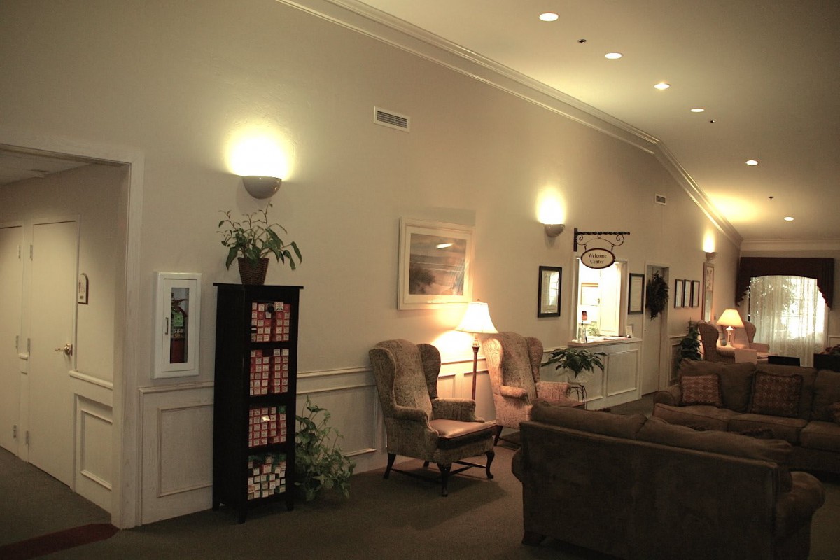 A cozy lounge area with comfortable seating and warm lighting.