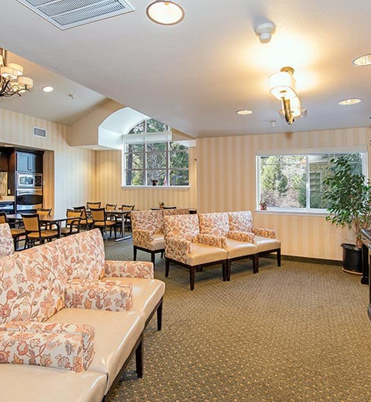 A cozy waiting room with ample seating and natural light.