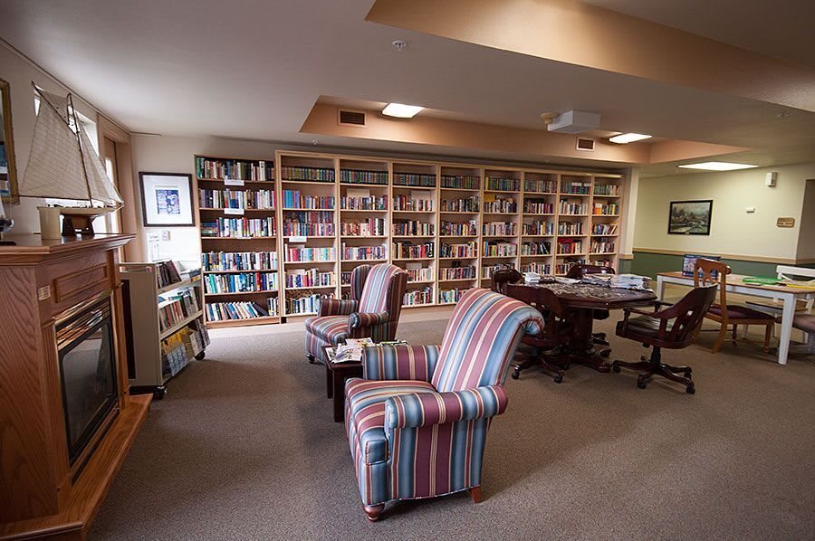 Cozy library with bookshelves and comfortable seating.