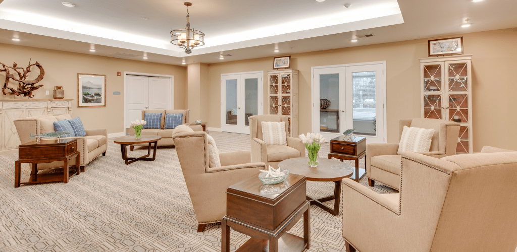 A modern and cozy living room with comfortable seating, elegant lighting, and tasteful decor.