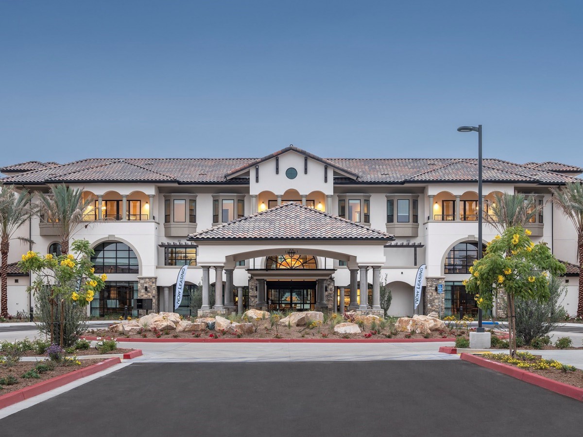 A luxurious residential building with a grand entrance and elegant facade.