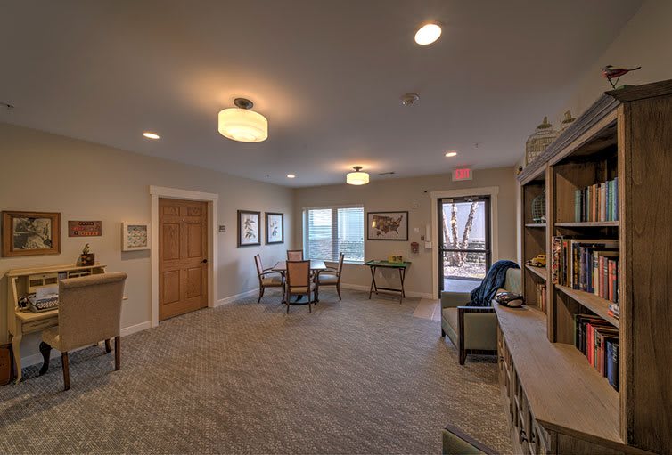 A cozy interior room with comfortable seating and warm lighting.