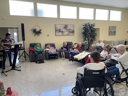 A group of seniors engaging in an activity at a community center.