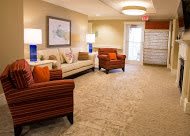 A cozy lobby with comfortable seating and warm lighting.