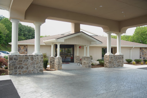 A welcoming entrance featuring elegant columns leading to a well-designed home.