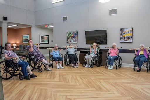 A group of senior citizens engaged in a social activity in a community center.
