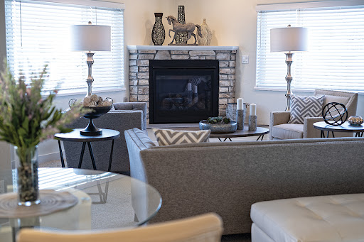 A beautifully designed living room featuring a cozy fireplace and modern furnishings.