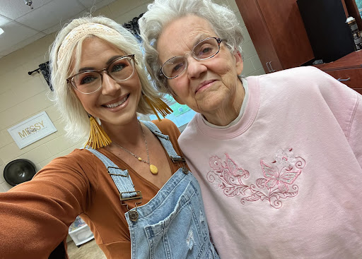 A joyful moment captured between a young woman and an elderly lady, showcasing their bond.