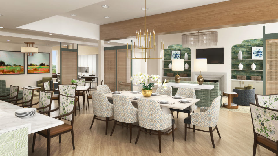 A modern dining room with elegant furnishings and a stylish chandelier.