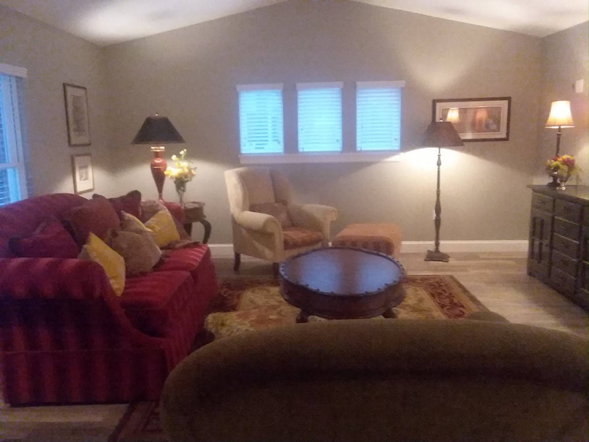 Cozy living room with comfortable seating and warm lighting.