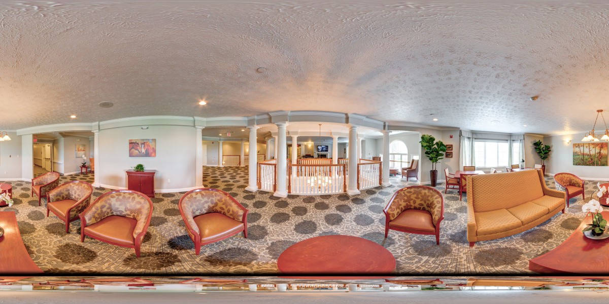 Spacious lobby with elegant seating and decorative architecture.