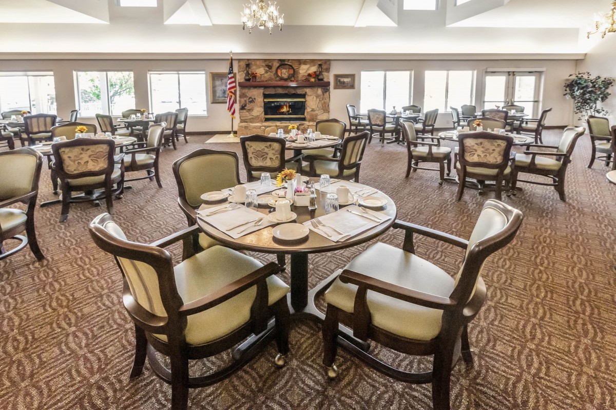 A well-arranged dining room with elegant tables and chairs.