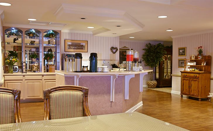 A cozy cafe with a well-arranged beverage station and inviting decor.