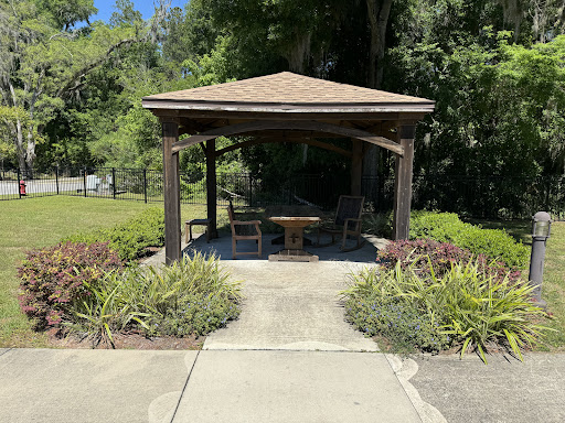 A serene gazebo surrounded by lush greenery, perfect for relaxation.