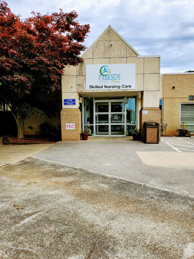 Entrance to a healthcare facility with clear signage and a well-maintained exterior.