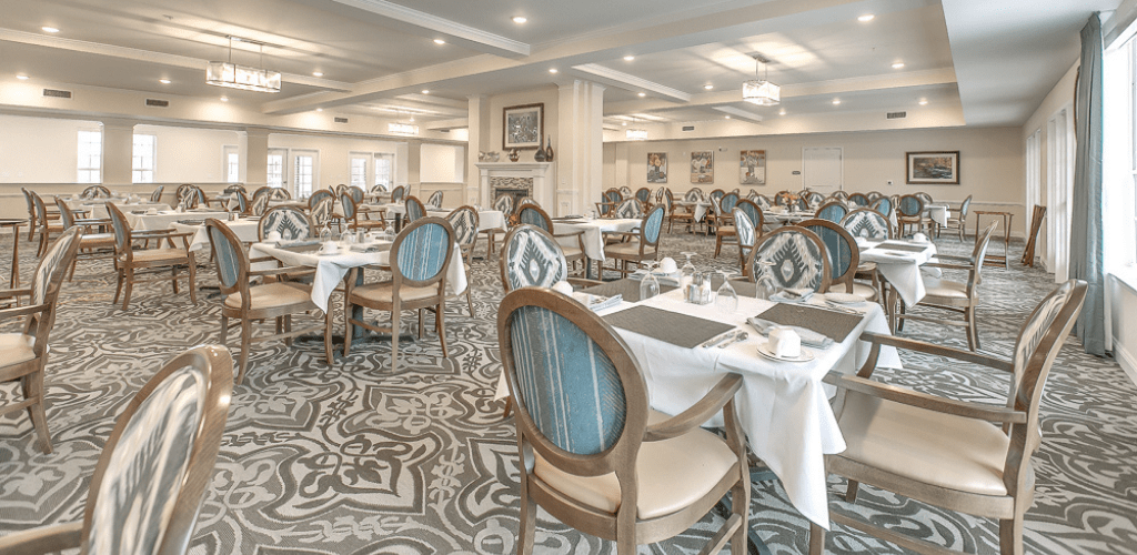 An elegant dining room with beautifully arranged tables and classic decor.