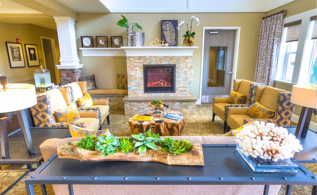 A cozy living room with a fireplace and stylish decor.
