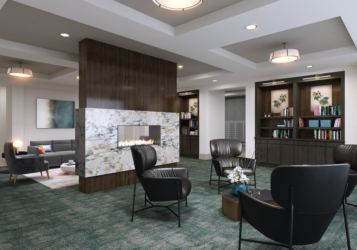A modern lobby featuring a fireplace with contemporary seating and elegant chandeliers.