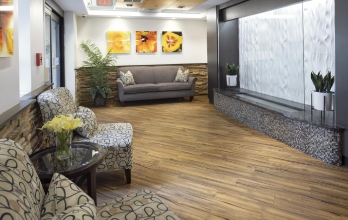 A modern waiting room with comfortable seating and tasteful decor.