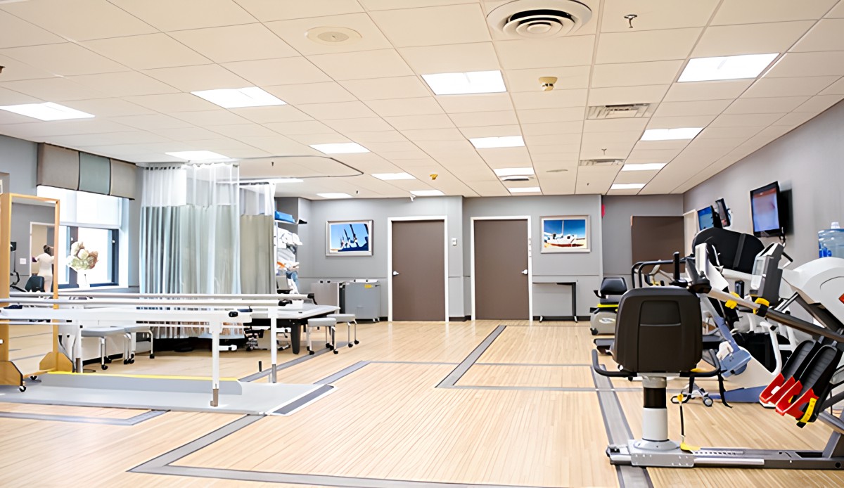 A modern office reception area with a sleek design and multiple doors leading to other rooms.