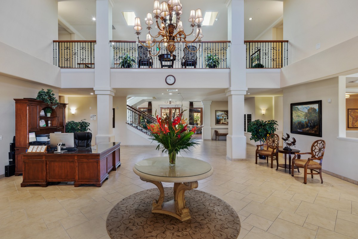 A luxurious lobby with elegant decor and a grand chandelier.