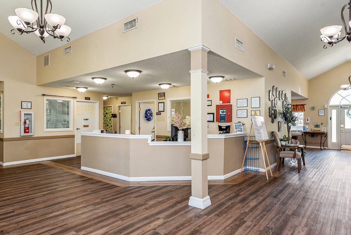 A welcoming reception area with modern interior design and wooden flooring.